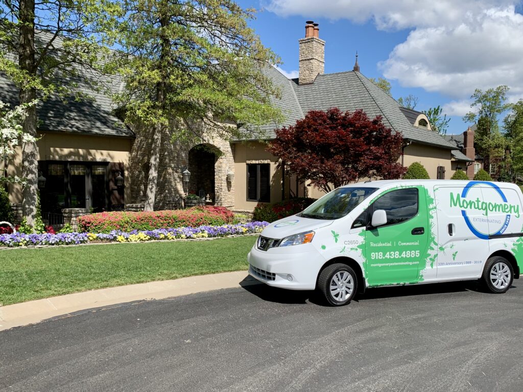 Montgomery Exterminating service van parked outside a home